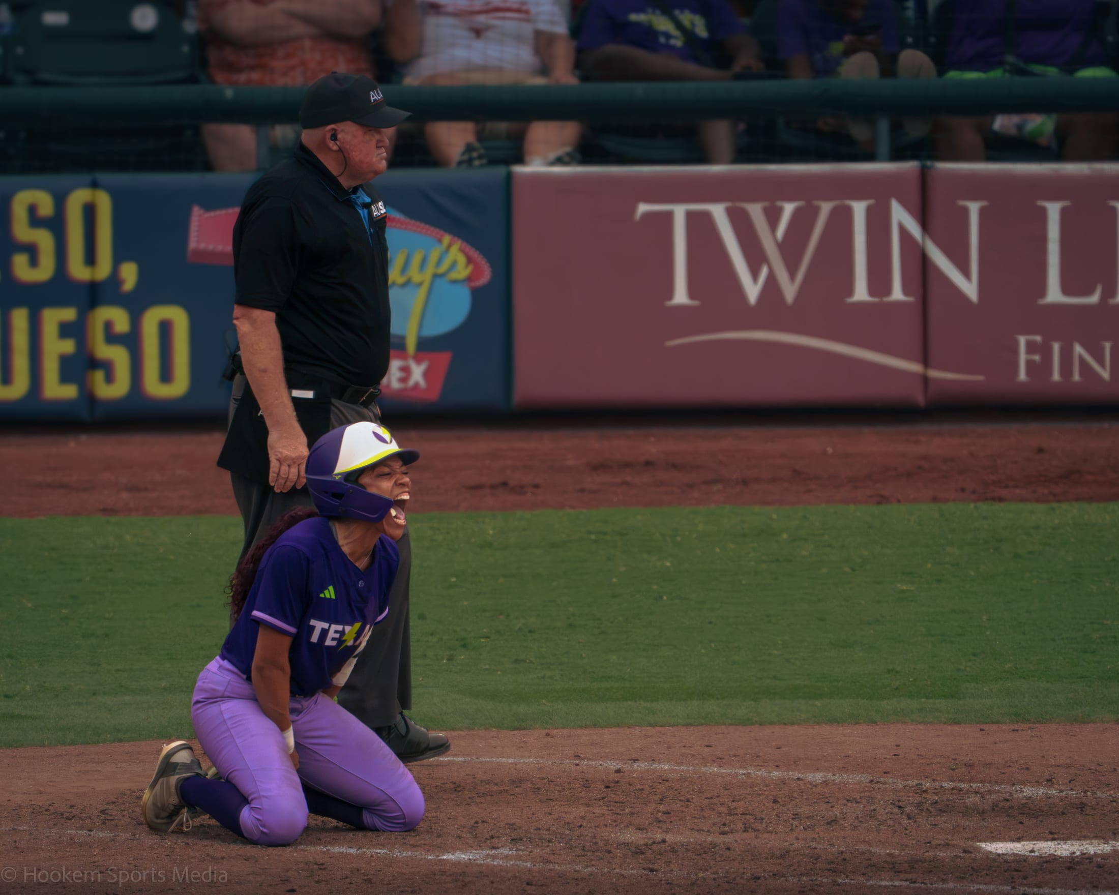 Rylie Boone celebrates after scoring the walk-off run at Dell Diamond.
